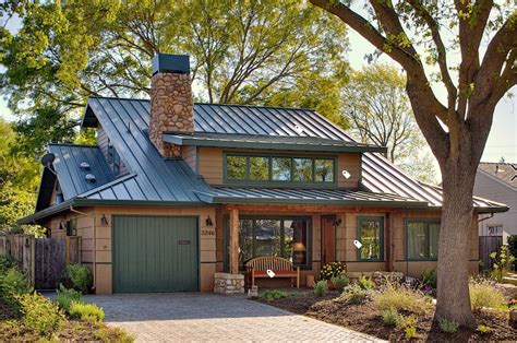 beige house with green metal roof|beige house with metal roof.